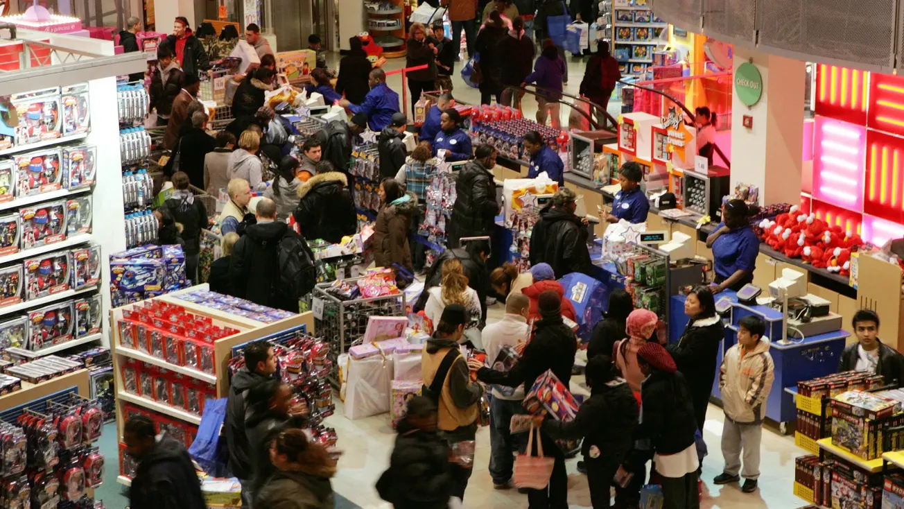 Shoppers at a busy retail store during the holidays.
